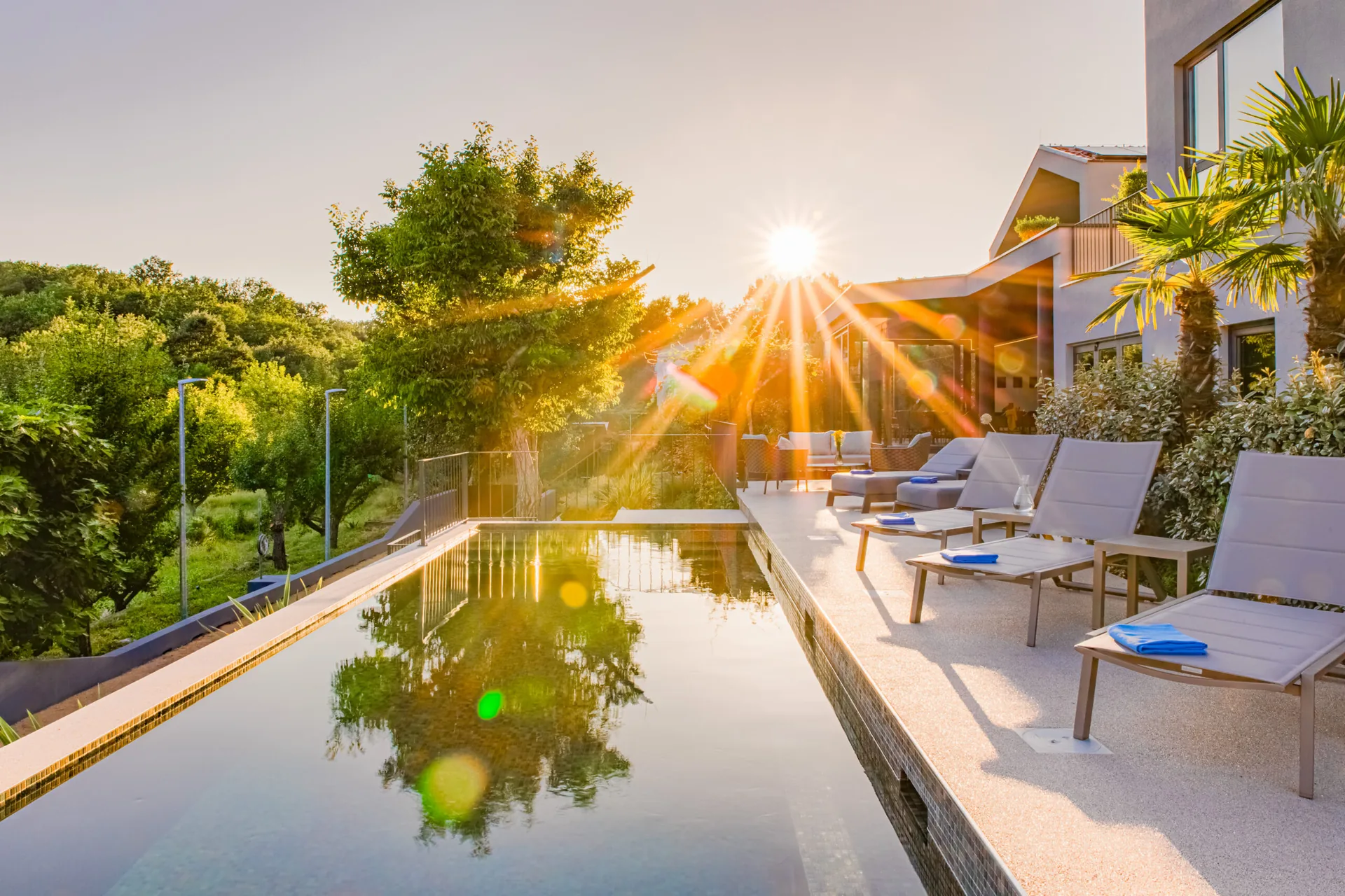 Casa Meline — sunset over the heated pool, luxury villa estate on the island of Krk.