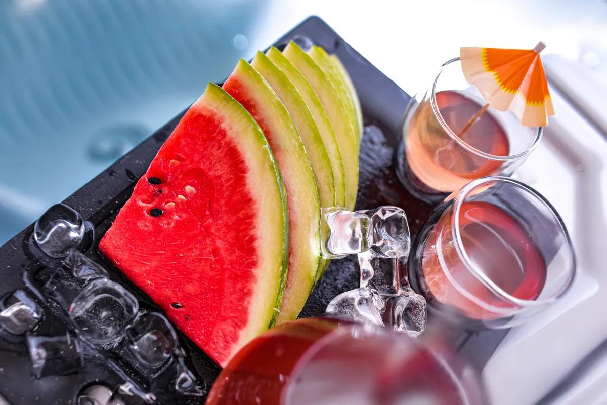 Poolside lifestyle — fresh watermelon and cocktails on ice at Casa Meline
