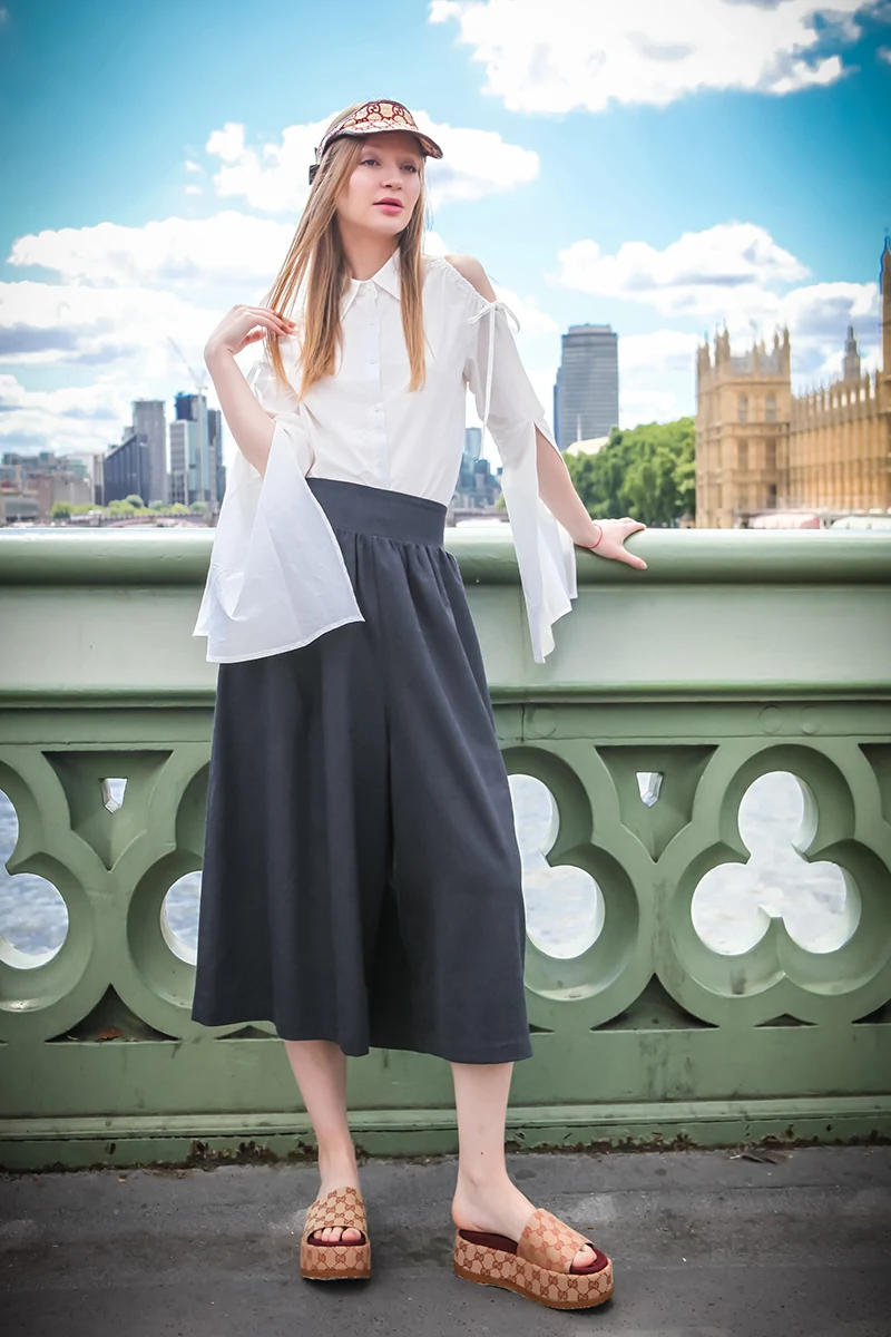 MOXI London fashion campaign — model on Westminster Bridge, London skyline