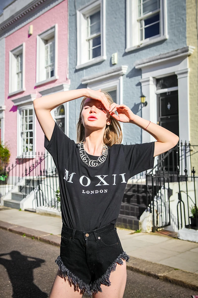 MOXI London street fashion editorial — model in Notting Hill with colourful Victorian terraces