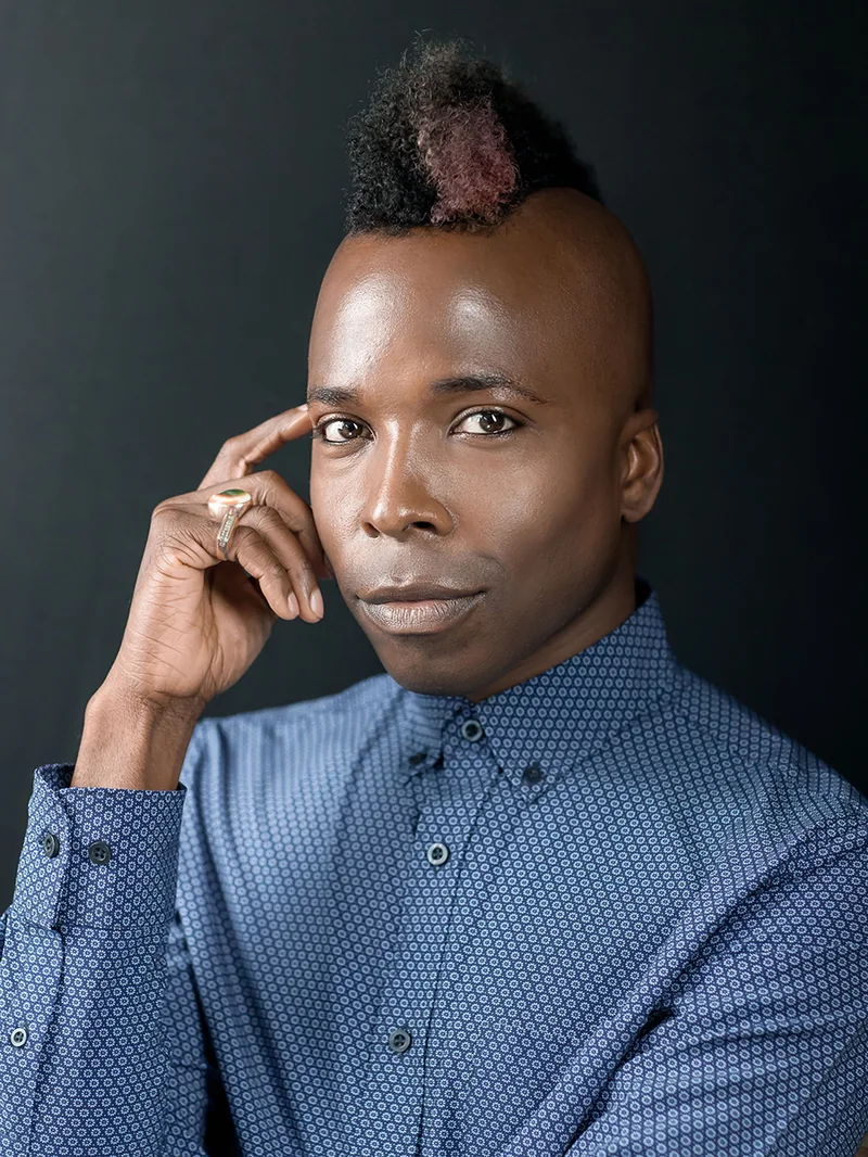 Studio portrait Zagreb — man with mohawk hairstyle, dark background, professional character portrait